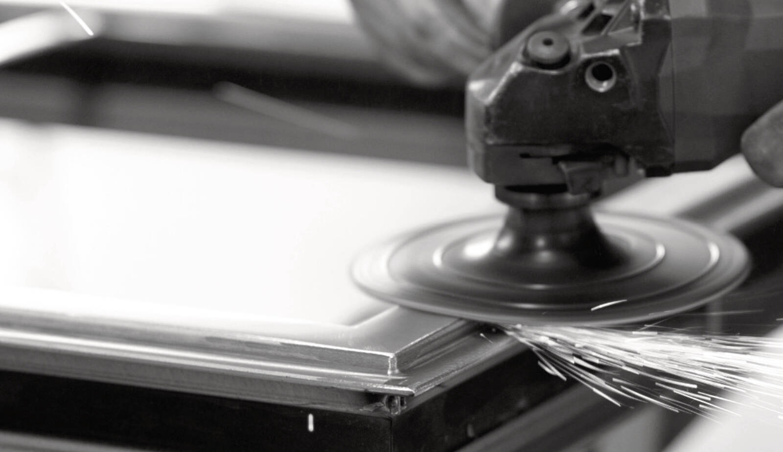 Skilled sanding techniques applied to premium metal doors for luxury Genesi architecture